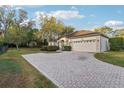 Charming home with a spacious driveway and lush landscaping in a serene setting at 250 Lakeridge Ct, Winter Springs, FL 32708