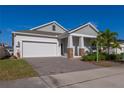 Inviting single-Gathering home with a spacious two-car garage and stylish brick-paved driveway at 2750 Slash Way, St Cloud, FL 34771