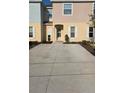 Charming townhome with an ample driveway and well-maintained landscaping for a welcoming curb appeal at 4707 Coral Castle Dr, Kissimmee, FL 34746