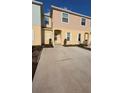 Charming townhome with an ample driveway and well-maintained landscaping for a welcoming curb appeal at 4707 Coral Castle Dr, Kissimmee, FL 34746