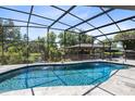 Beautiful pool with a screened-in enclosure and gazebo in a well-maintained backyard at 5370 Whispering Pine Cir, St Cloud, FL 34771