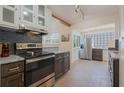 Updated kitchen featuring modern stainless steel appliances, sleek countertops, and plenty of storage space at 602 Rugby St, Orlando, FL 32804