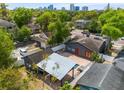 Aerial view of home showcasing the backyard, patio, city skyline, and neighborhood at 833 N Thornton Ave, Orlando, FL 32803