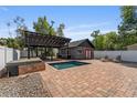 Backyard featuring a pool, cabana, and brick patio with outdoor seating at 833 N Thornton Ave, Orlando, FL 32803