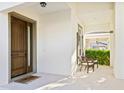 Welcoming front porch with decorative door and seating area, offering a cozy entrance at 14645 Scott Key Dr, Winter Garden, FL 34787