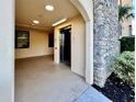 An elevator next to a stone wall that adds a touch of elegance to the building at 16300 County Road 455 # 513, Montverde, FL 34756