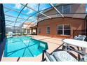 Enjoy this screened-in pool with plenty of sunshine and room for entertaining guests at 217 Sevilla Ave, Davenport, FL 33897