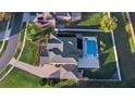 Aerial view of the home with a fenced backyard, featuring a private pool and spa with a screened lanai at 3138 Lee Shore Loop, Orlando, FL 32820