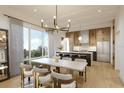 Elegant dining room featuring modern lighting, large windows, and stylish furnishings perfect for entertaining and Gathering meals at 1004 E Robinson St # 1, Orlando, FL 32801