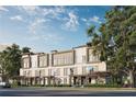 Modern townhomes featuring sleek lines, large windows, and inviting outdoor areas, surrounded by lush greenery at 1004 E Robinson St # 1, Orlando, FL 32801