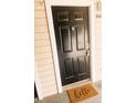 Charming front door with a welcoming 'hello' doormat at 1017 S Hiawassee Rd # 3735, Orlando, FL 32835
