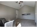 Cozy living room with neutral carpet and walls, featuring a ceiling fan at 1017 S Hiawassee Rd # 3735, Orlando, FL 32835