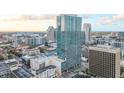 Contemporary building with modern architecture featuring a rooftop pool amenity and breathtaking city views at 150 E Robinson St # 807, Orlando, FL 32801