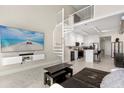 Contemporary living room with a spiral staircase that leads to the loft area overlooking the modern kitchen at 150 E Robinson St # 807, Orlando, FL 32801
