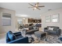Open-concept living room flows into the kitchen and dining area, perfect for entertaining and Gathering gatherings at 1565 Mulligan Blvd, Davenport, FL 33896