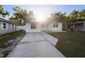 Classic single-story home with a spacious driveway and landscaped front yard at 241 S Marydell Ave, Deland, FL 32720