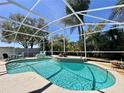 Enclosed pool with seating area and lush foliage at 2519 Cypress Trace Cir, Orlando, FL 32825