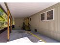 Spacious carport featuring storage and convenient access to the home's entrance at 410 N Niblick Ln, Lake Mary, FL 32746