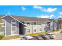 Apartment building with gray paint, arched windows, and gray roof at 4314 Pershing Pointe Pl # 4, Orlando, FL 32822