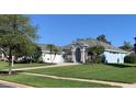 A beautiful single-Gathering home with a well-manicured lawn and lush landscaping at 504 Sonata Ct, Winter Springs, FL 32708
