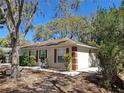 Well-maintained single story home with a side view showing neat landscaping and driveway at 511 Terrier Way, New Smyrna Beach, FL 32168