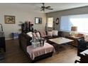 Comfortable living room with a plush sofa, hardwood floors and natural light at 58 Magnolia Dr, Debary, FL 32713