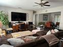 Spacious living room featuring hardwood floors and a ceiling fan at 58 Magnolia Dr, Debary, FL 32713