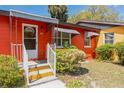 Close-up of the front entrance, showcasing the colorful exterior at 612 Kensington St, Eustis, FL 32726