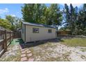 Spacious backyard featuring a separate shed and privacy fence at 831 Wolf Trl, Casselberry, FL 32707