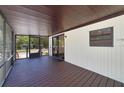 Enclosed back porch area with sliding glass doors leading inside at 831 Wolf Trl, Casselberry, FL 32707