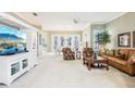 Bright and spacious living room with a view to dining area and backyard at 14336 Dulcimer Ct, Orlando, FL 32837