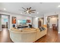 Spacious living room featuring hardwood floors, recessed lighting, and an open floor plan at 16781 Wingspread Loop, Winter Garden, FL 34787