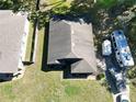Aerial view of a property, featuring a well-maintained roof and surrounding landscape at 1931 Clarcona Rd, Apopka, FL 32703