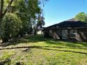 Expansive backyard featuring lush green grass, providing ample space for outdoor activities and relaxation at 1931 Clarcona Rd, Apopka, FL 32703