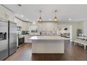 Modern kitchen boasts stainless steel appliances, quartz countertops, and an open layout at 2136 Topping Pl, Eustis, FL 32726