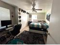 Bedroom with a neutral-toned walls and tiled floor providing a simple aesthetic at 227 Strawberry Ln, Daytona Beach, FL 32117