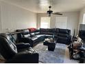 Cozy living room showcasing a plush sectional sofa and contemporary decor at 227 Strawberry Ln, Daytona Beach, FL 32117