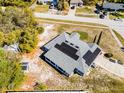 Birds eye view of home with solar panels on roof and spacious surrounding property at 380 Dorset Ave, Deltona, FL 32738