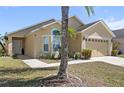 Inviting single-story home showcasing a well-manicured lawn and welcoming entrance at 459 Tivoli Cir, Davenport, FL 33837