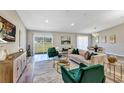 Bright and airy living room with hardwood floors, stylish furniture and lots of natural light at 5307 Sandy Hill Dr, Orlando, FL 32821