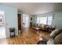 Inviting living room featuring wood flooring and a large window with natural light at 613 Andrew St, Altamonte Springs, FL 32714