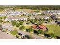 Wide aerial view highlighting the community layout, including a playground and surrounding residential homes at 9513 Amber Chestnut Way, Winter Garden, FL 34787