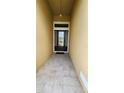 Inviting entryway with decorative glass door, tiled flooring, and recessed lighting at 2749 Sand Oak Loop, Apopka, FL 32712