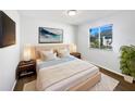 Cozy bedroom with a large window, neutral tones, and stylish bedside tables at 3951 Haynes Cir, Casselberry, FL 32707