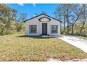 Charming single-Gathering home featuring a well-maintained front yard and a neatly paved driveway at 435 Lincoln Ave, Oviedo, FL 32766