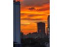 Dramatic skyline sunset over downtown buildings creating a vibrant cityscape at 530 E Central Blvd # 705, Orlando, FL 32801