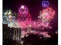 Colorful fireworks over downtown buildings create a dazzling night view at 530 E Central Blvd # 705, Orlando, FL 32801