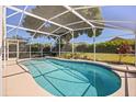 Inviting screened-in pool area, perfect for relaxation and outdoor entertaining, surrounded by well-maintained landscaping at 813 Havenwood Dr, Orlando, FL 32828