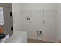 Functional laundry room with shelving, hookups, and ample space for appliances at 115 Royalty Cir, Sanford, FL 32771