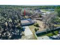 Aerial view of the home with a spacious lot and long driveway at 120 Lake Dr, Oviedo, FL 32765